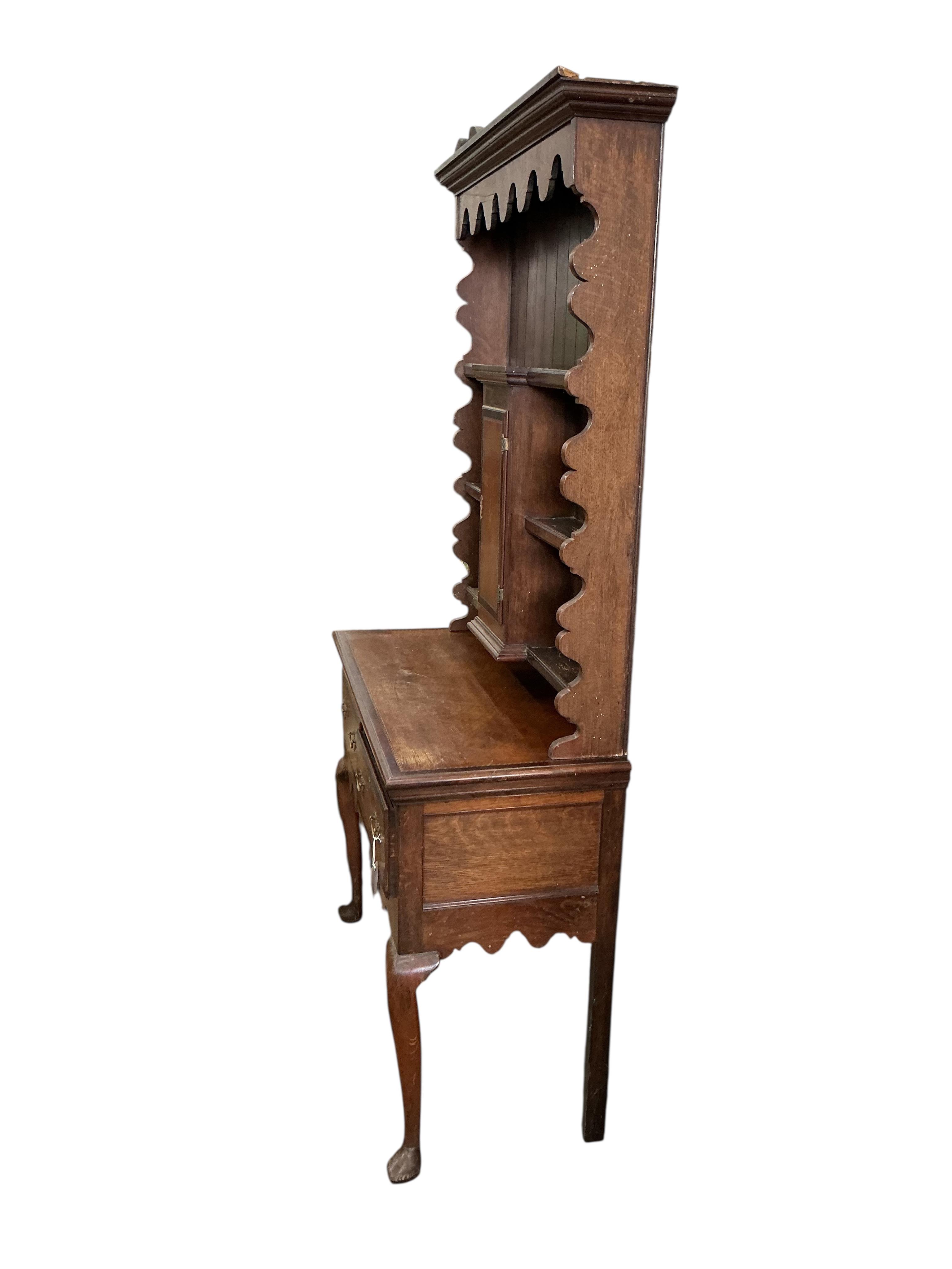 An early 20th century inlaid oak narrow dresser, width 104cm, depth 46cm, height 198cm